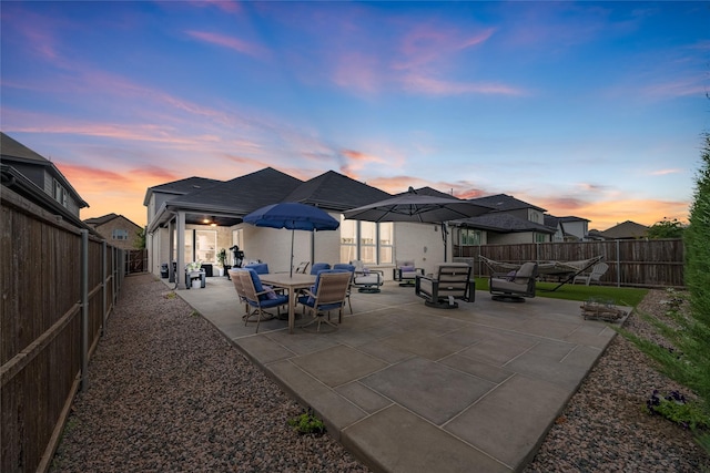 view of patio terrace at dusk