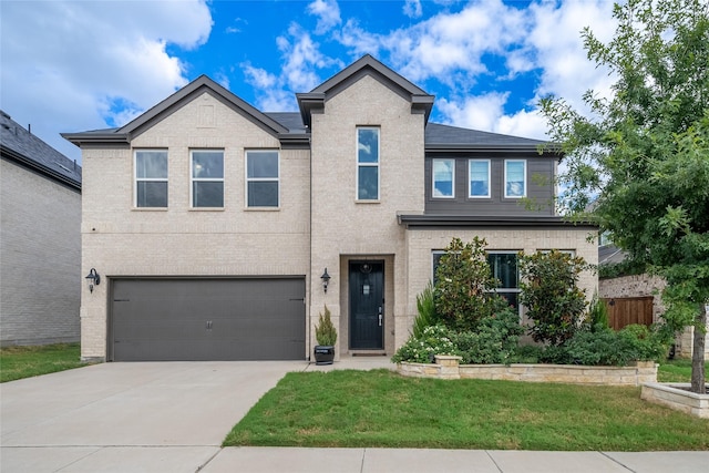 view of front of home with a garage and a front lawn