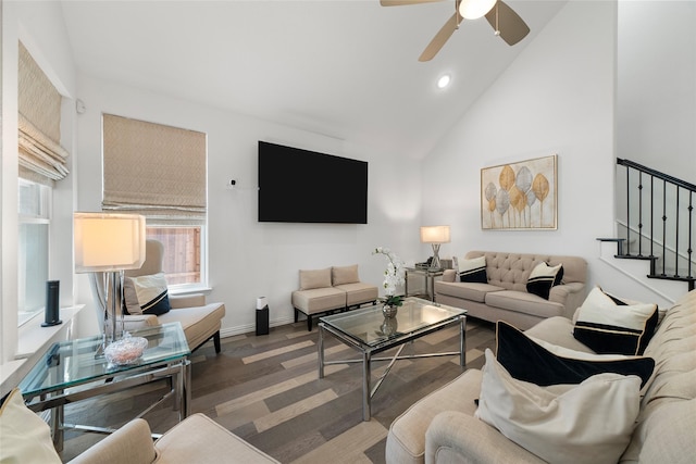 living room featuring ceiling fan, dark hardwood / wood-style floors, and high vaulted ceiling