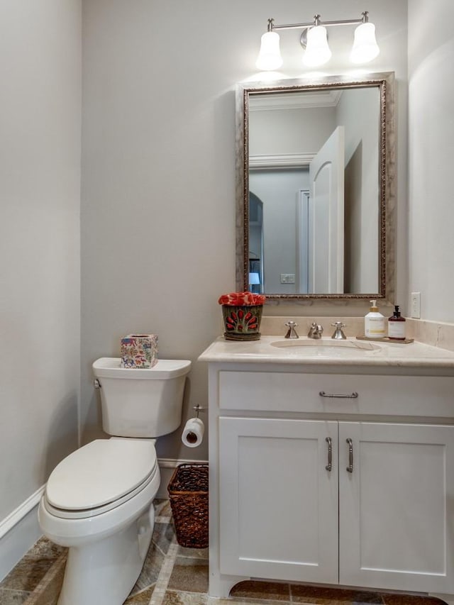 bathroom with toilet and vanity