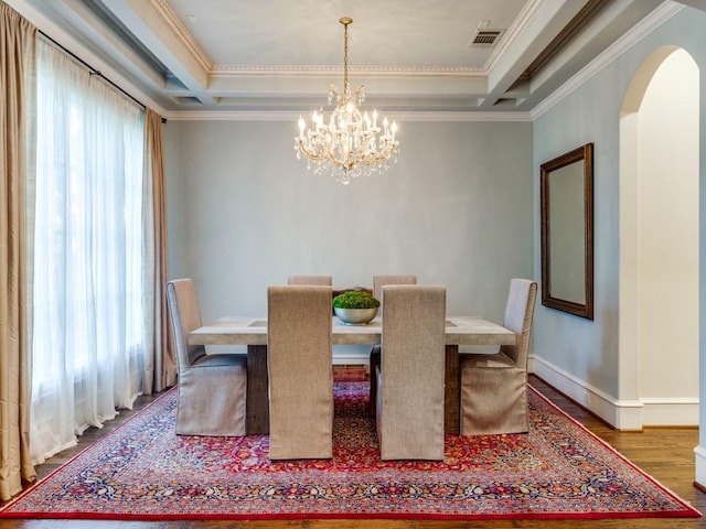 dining space featuring coffered ceiling, beamed ceiling, and a wealth of natural light