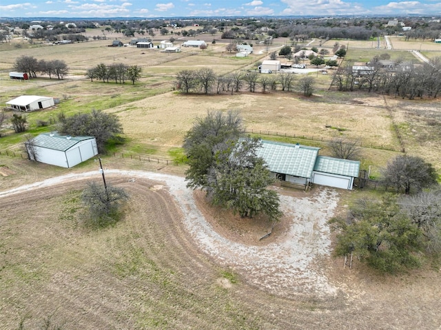 birds eye view of property featuring a rural view