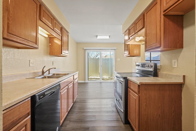 kitchen featuring sink, dark hardwood / wood-style flooring, black dishwasher, and stainless steel electric range oven