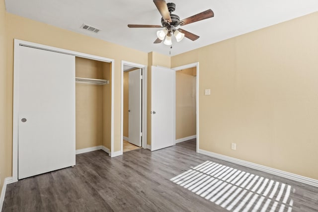 unfurnished bedroom featuring a closet, ceiling fan, and hardwood / wood-style floors