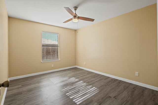 unfurnished room with ceiling fan and dark hardwood / wood-style floors