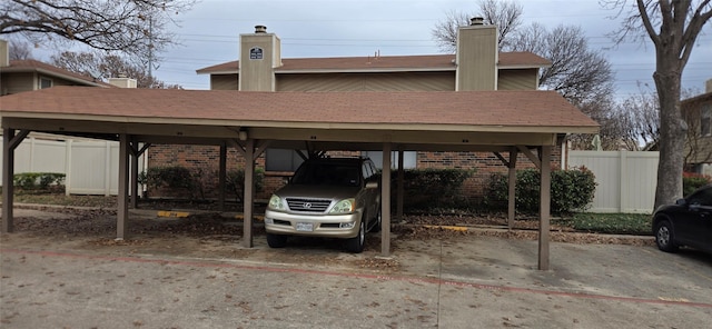 view of vehicle parking with a carport