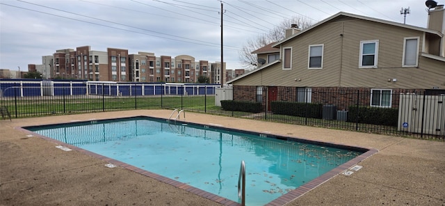 view of pool featuring a yard