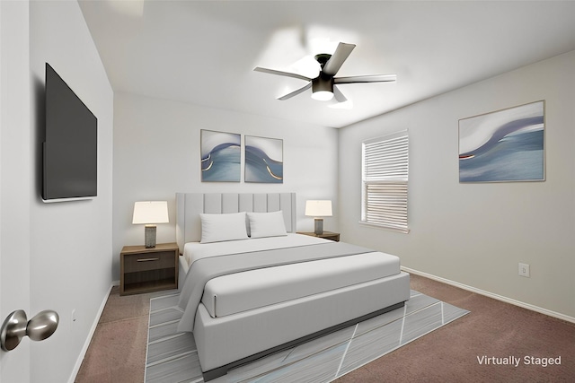 bedroom with carpet floors, ceiling fan, and baseboards