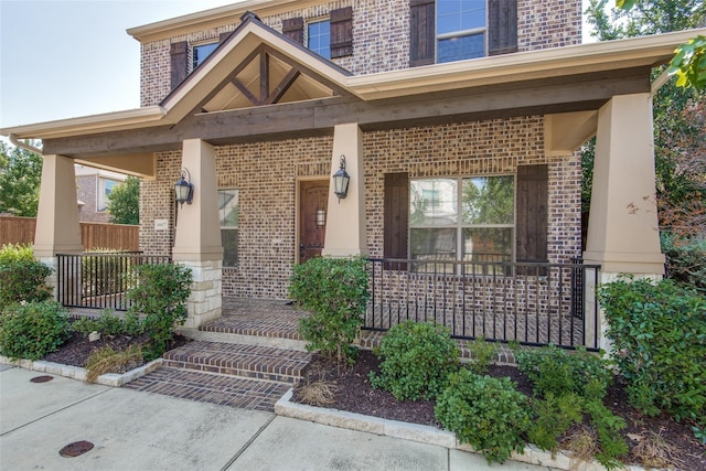 doorway to property featuring a porch