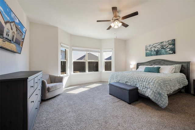 bedroom featuring ceiling fan and carpet