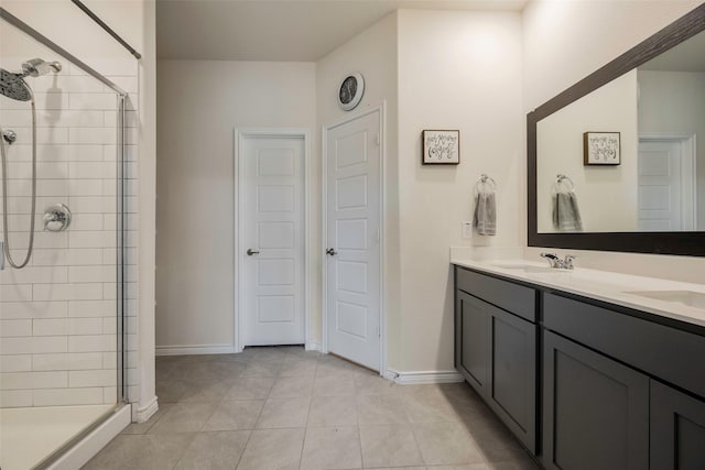 bathroom featuring vanity, a shower with shower door, and tile patterned floors