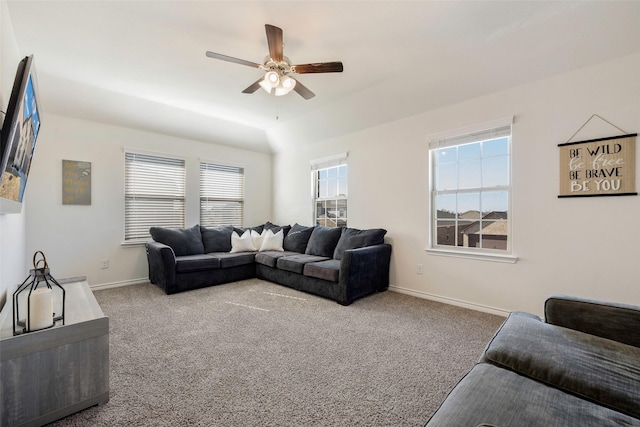 carpeted living room featuring ceiling fan