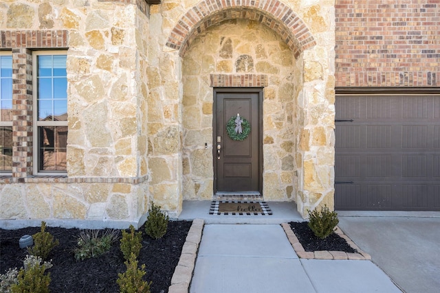 doorway to property featuring a garage