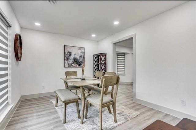 dining room featuring light hardwood / wood-style flooring