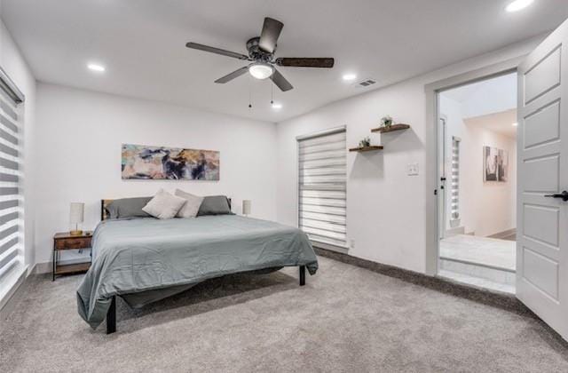 bedroom with light carpet and ceiling fan