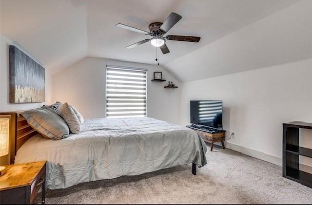 carpeted bedroom featuring ceiling fan and lofted ceiling