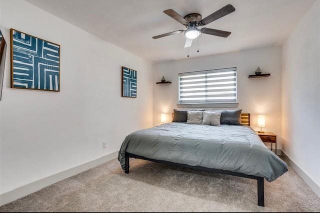 bedroom featuring ceiling fan and light colored carpet