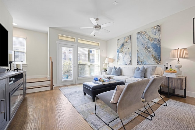 living room with hardwood / wood-style floors and ceiling fan