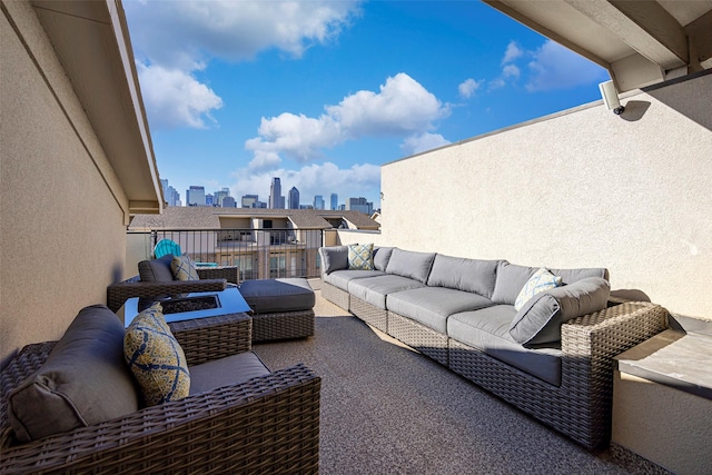 view of patio featuring a balcony and outdoor lounge area