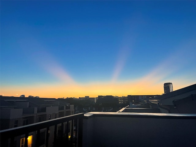 view of balcony at dusk