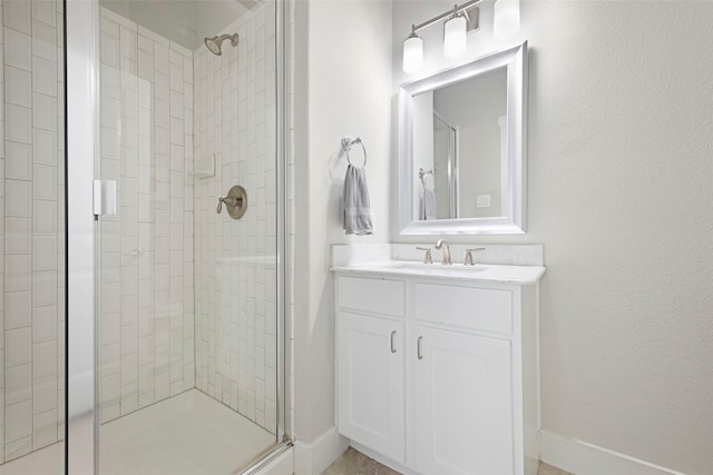 bathroom with vanity and walk in shower