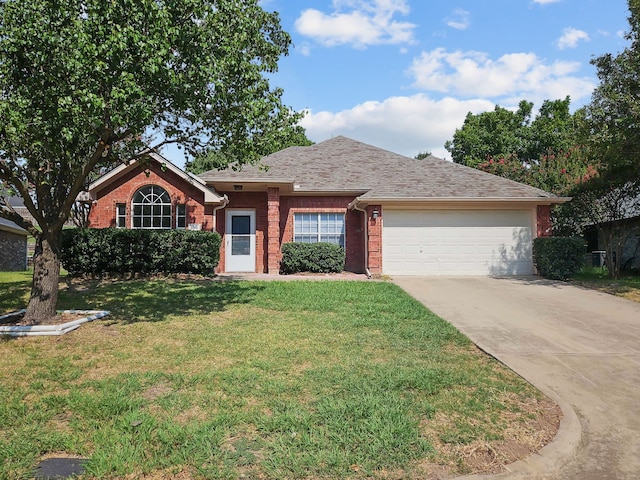 ranch-style home with a garage and a front yard