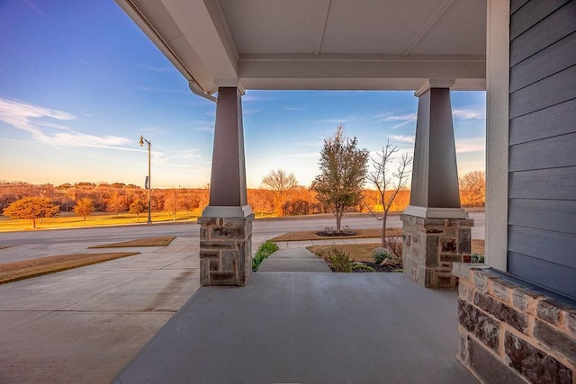 view of patio terrace at dusk