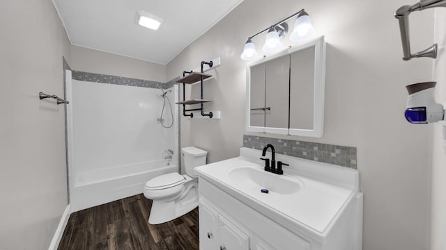 full bathroom featuring hardwood / wood-style flooring, toilet, decorative backsplash, vanity, and tub / shower combination