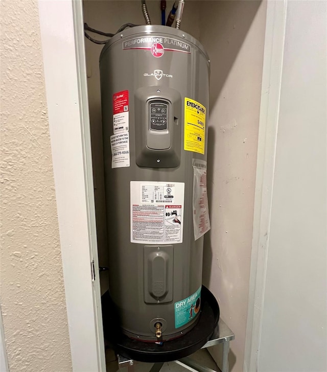 utility room with water heater