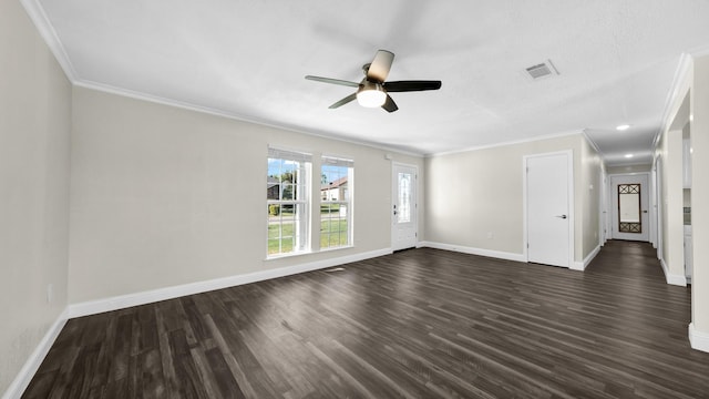 spare room featuring ornamental molding, dark hardwood / wood-style floors, and ceiling fan