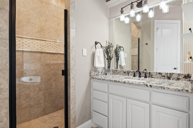 bathroom with vanity, ornamental molding, and an enclosed shower