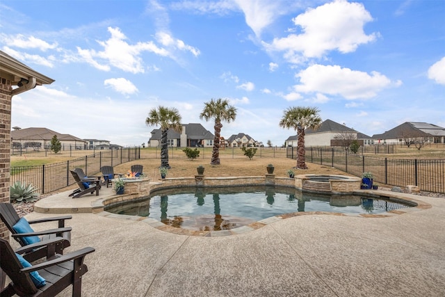 view of swimming pool featuring an in ground hot tub and a patio area