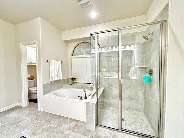 bathroom featuring separate shower and tub and toilet