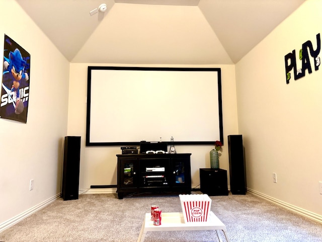 carpeted cinema featuring vaulted ceiling