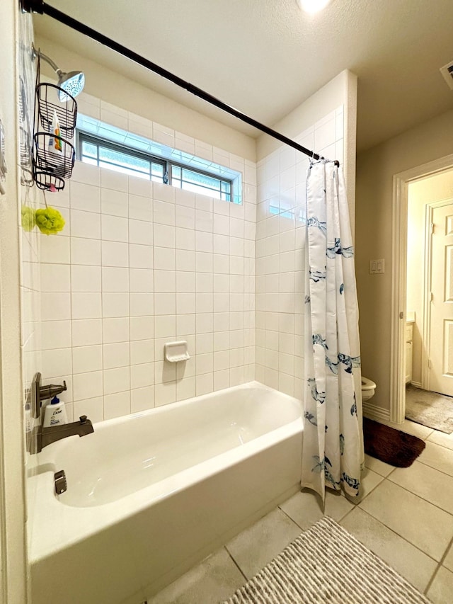 bathroom featuring shower / tub combo with curtain and tile patterned floors