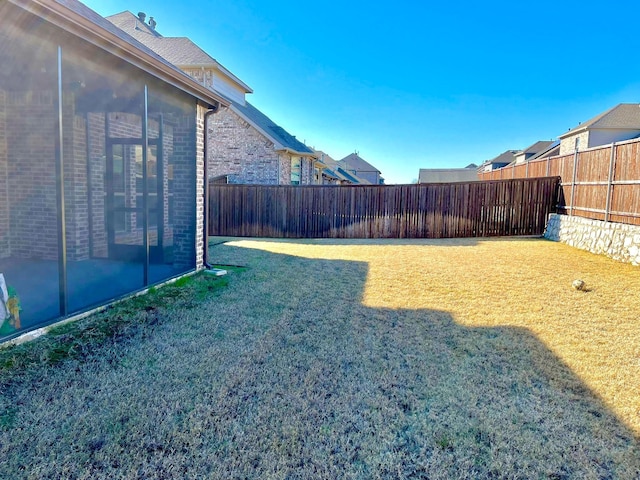 view of yard featuring a sunroom