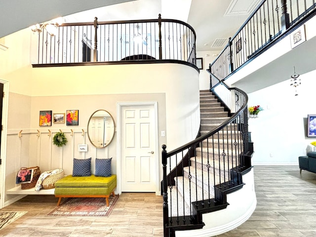 stairway with a towering ceiling