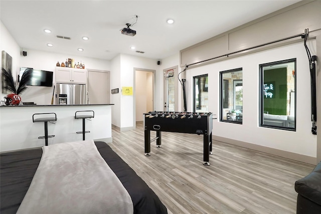 game room featuring light hardwood / wood-style floors