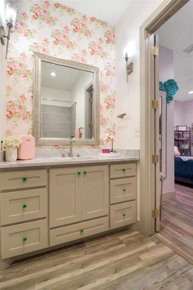 bathroom with wood-type flooring and vanity