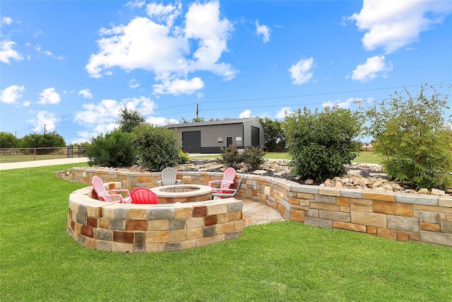 view of yard featuring an outdoor fire pit and a patio