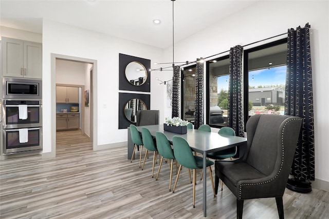 dining area with light hardwood / wood-style flooring