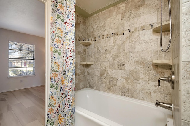 bathroom featuring shower / bath combo and hardwood / wood-style flooring