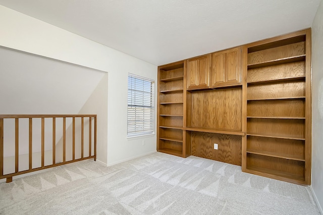 interior space featuring light carpet