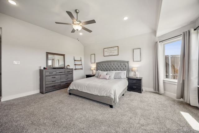 bedroom with vaulted ceiling, ceiling fan, and light carpet