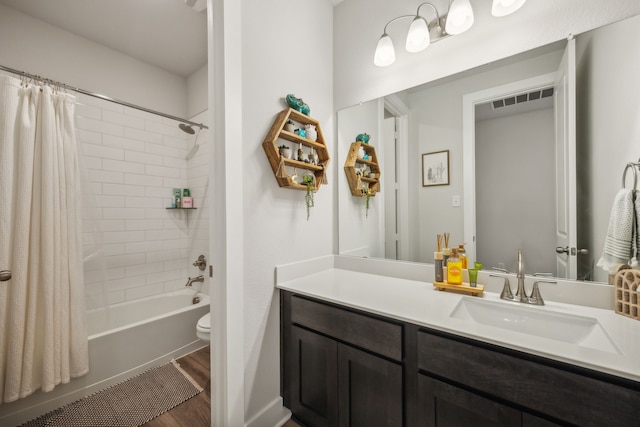 full bathroom with vanity, toilet, shower / bath combo, and wood-type flooring