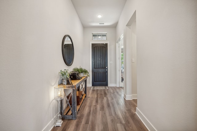 entrance foyer featuring hardwood / wood-style flooring and a high ceiling