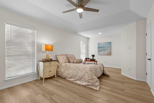 bedroom with ceiling fan and light hardwood / wood-style flooring