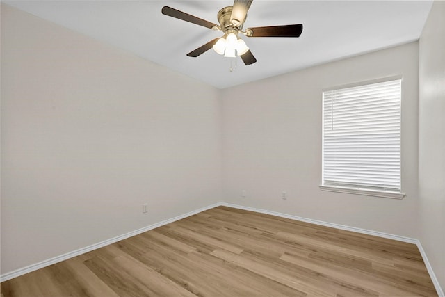 empty room with ceiling fan and light wood-type flooring