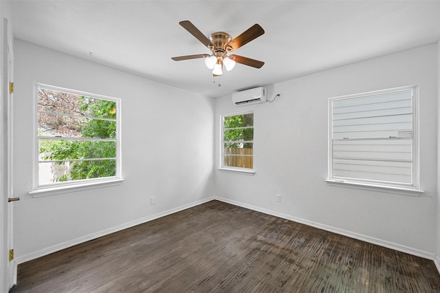 unfurnished room with a wall mounted air conditioner, ceiling fan, plenty of natural light, and dark hardwood / wood-style flooring