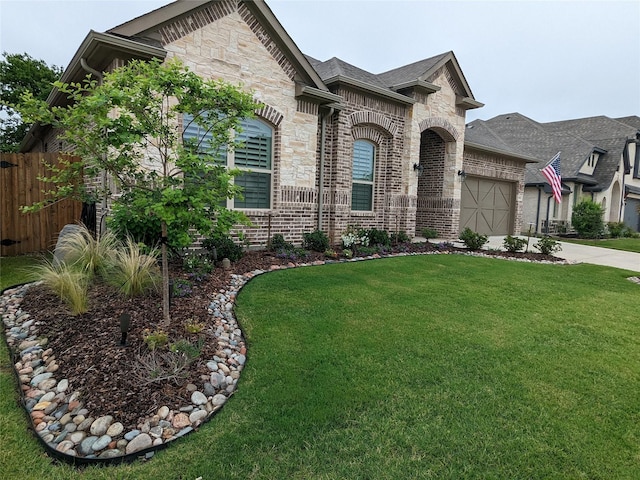 french country home featuring a garage and a front yard